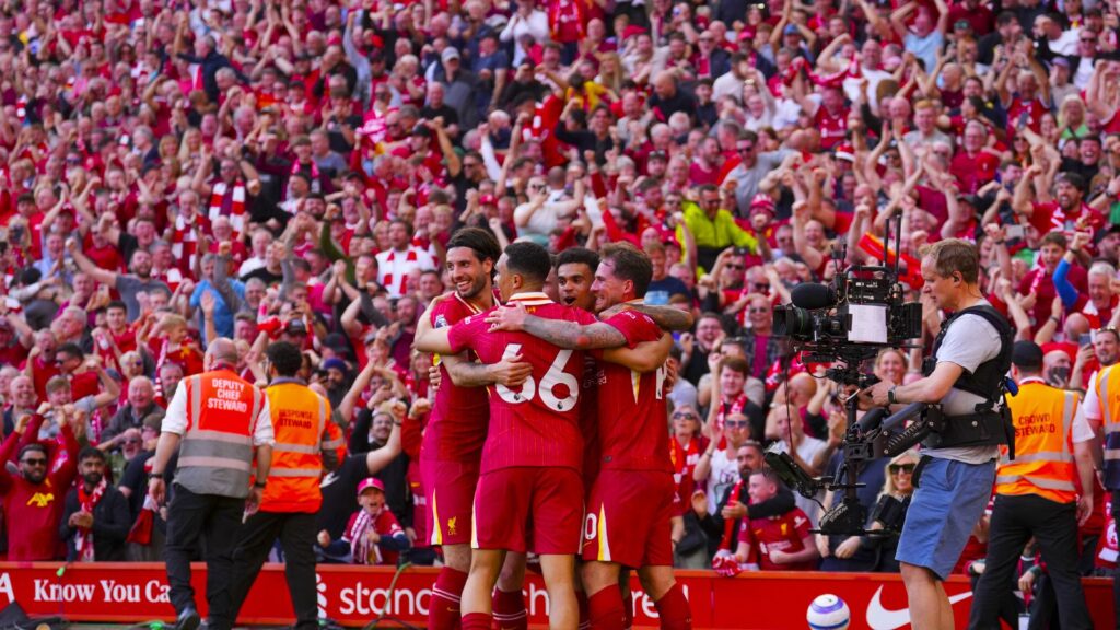 Liverpool’s Alexis Mac Allister, right, celebrates with teammates after scoring his side’s second goal during the English Premier League soccer match between Liverpool and Tottenham Hotspur at Anfield in Liverpool, England, Sunday, April 27, 2025. (AP Photo)
