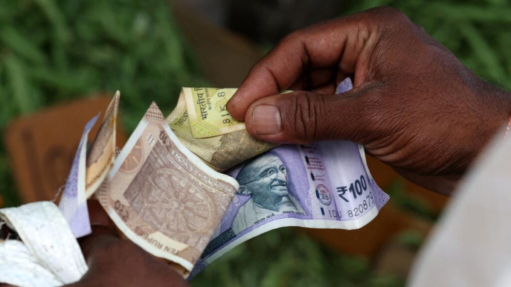 Rupee falls 13 paise to close at 87.71 against U.S. dollar