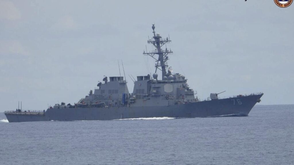 U.S. briefly deploys two warships to a disputed South China Sea shoal after Chinese collision