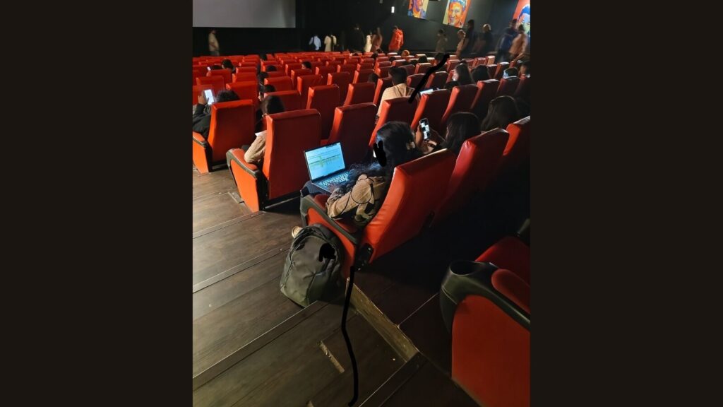Bengaluru woman seen working on laptop inside movie theatre in viral pic: ‘Work From (Cinema) Hall’ Bengaluru woman seen working on laptop inside movie theatre in viral pic: 'Work From (Cinema) Hall'