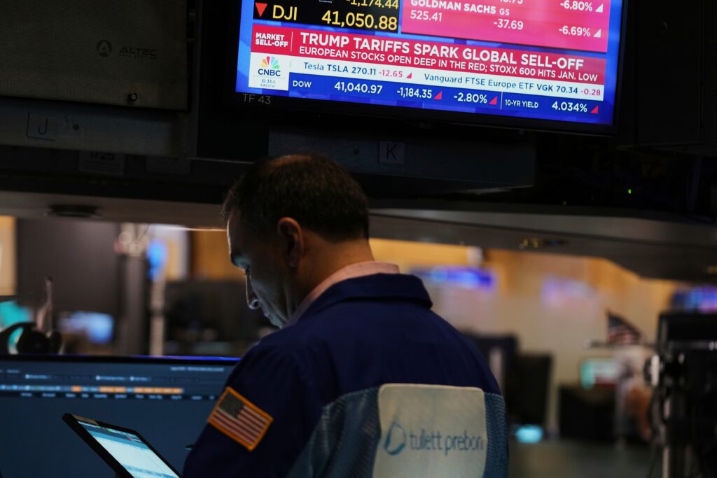 Traders work on the floor at the New York Stock Exchange in New York. (AP Photo/Seth Wenig)