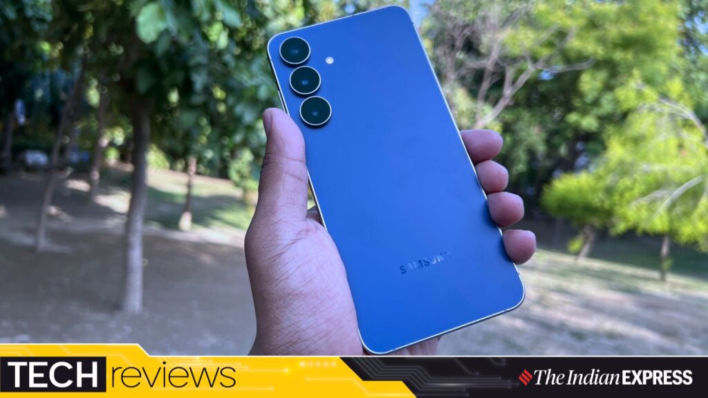 The Galaxy S25 FE in navy blue offers a sleek, smudge-resistant design. (Image: Bijin Jose/The Indian Express)